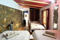Posteľ alebo postele v izbe v ubytovaní Cinco Lunas VEGETARIAN Guesthouse