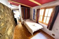 Posteľ alebo postele v izbe v ubytovaní Cinco Lunas VEGETARIAN Guesthouse
