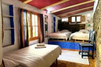 Posteľ alebo postele v izbe v ubytovaní Cinco Lunas VEGETARIAN Guesthouse
