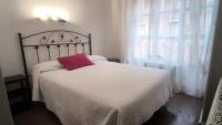 Posteľ alebo postele v izbe v ubytovaní Hostal Hispano