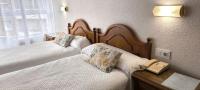 Posteľ alebo postele v izbe v ubytovaní Hostal Hispano