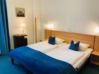 Postel nebo postele na pokoji v ubytování Penzion Hotelu Central