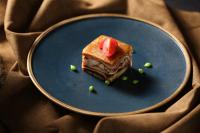 a blue plate with a piece of cake on it at InterContinental Beijing Beichen by IHG in Beijing
