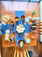 a table with bowls and dishes on top of it at The Cube in Kegalle