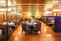 a dining room with a table and chairs at Intercontinental Jinan City Center by IHG in Jinan