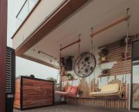 a room with swings and chairs on the wall at Accra Luxury Apartments @ The Signature in Accra