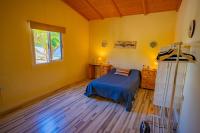 Postel nebo postele na pokoji v ubytování Casa Rural Buda Terra
