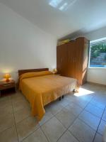 A bed or beds in a room at Villa Karillos