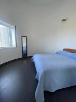 A bed or beds in a room at Villa Karillos