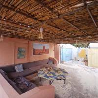 a living room with a couch and a table at "Par 4 chemins" Atypical Stopover in Nouakchott