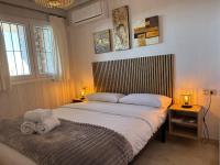 Postel nebo postele na pokoji v ubytování Tolles Ferienhaus mit Sonnenterrasse direkt am Meer