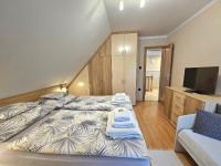 Łóżko lub łóżka w pokoju w obiekcie Apartman Siesta Bük - Bükfürdő