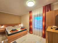 Łóżko lub łóżka w pokoju w obiekcie Apartman Siesta Bük - Bükfürdő