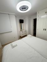 Postel nebo postele na pokoji v ubytování Apartamentos Carmela