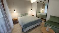 Posteľ alebo postele v izbe v ubytovaní 120 w 5 gwiazdowym ROYAL TULIP SAND 200 m od plaży DOBRUK APARTAMENTY