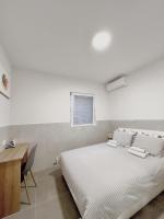 Postel nebo postele na pokoji v ubytování Lina Rooms Hostel