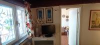 A television and/or entertainment centre at Casa in giardino