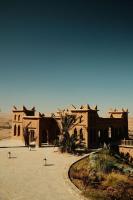 a large building in the middle of the desert at Kasbah d'if in Marrakech