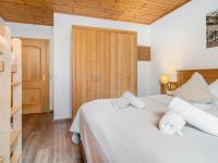 Łóżko lub łóżka w pokoju w obiekcie Alpensteinbock Saalbach A