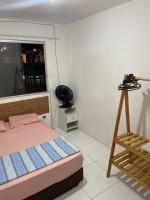 Pousada hostel praia itapuaにあるベッド