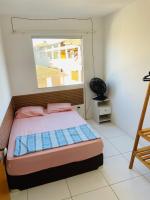 Pousada hostel praia itapuaにあるベッド