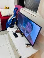 Pousada hostel praia itapuaにあるテレビまたはエンターテインメントセンター