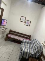 Pousada hostel praia itapuaにあるベッド