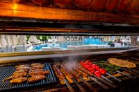 a grill with meat and other food on it at Hotel Aqua in Marmaris