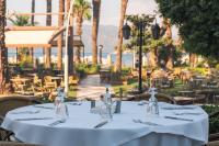 a table in a restaurant with a white table cloth at Hotel Aqua in Marmaris