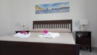 Posteľ alebo postele v izbe v ubytovaní Holiday Home Tarinuzza
