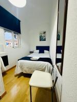 Posteľ alebo postele v izbe v ubytovaní Apartamentos Jamé Mérida