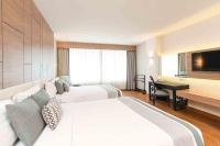 Ein Bett oder Betten in einem Zimmer der Unterkunft Phuket Graceland Resort and Spa