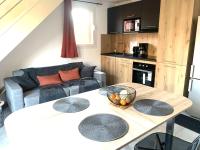 Kuchyňa alebo kuchynka v ubytovaní Résidence hôtelière les hameaux de saint cyprien appartement 2 chambres