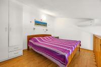 Postel nebo postele na pokoji v ubytování Apartments Mijic