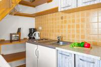Kuchyň nebo kuchyňský kout v ubytování Apartments Mijic