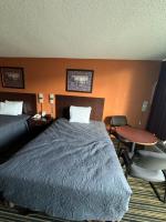Ein Bett oder Betten in einem Zimmer der Unterkunft labh inc Motel