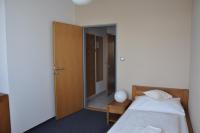Łóżko lub łóżka w pokoju w obiekcie Hotel Lions Plzen