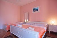 Posteľ alebo postele v izbe v ubytovaní Apartment and Rooms Toka