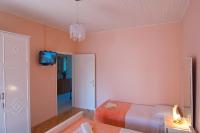Posteľ alebo postele v izbe v ubytovaní Apartment and Rooms Toka