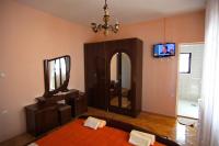 Televízia a/alebo spoločenská miestnosť v ubytovaní Apartment and Rooms Toka