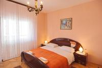 Posteľ alebo postele v izbe v ubytovaní Apartment and Rooms Toka