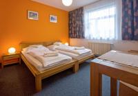 Łóżko lub łóżka w pokoju w obiekcie Hotel Lions Plzen