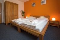 Łóżko lub łóżka w pokoju w obiekcie Hotel Lions Plzen