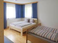 A bed or beds in a room at holiday home Emberger, Fügen