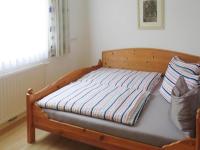 A bed or beds in a room at holiday home Emberger, Fügen