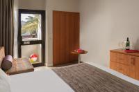 Ein Bett oder Betten in einem Zimmer der Unterkunft Leonardo Privilege Eilat Hotel - All inclusive