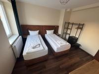 Hotel Capitol Zentrum - 24h -にあるベッド