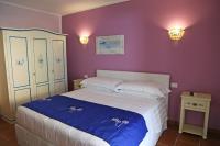 Łóżko lub łóżka w pokoju w obiekcie Villa Piana