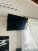 Televízia a/alebo spoločenská miestnosť v ubytovaní Joyas cosy apartment