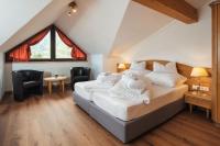 Łóżko lub łóżka w pokoju w obiekcie Hotel Garni Alpenruh-Micheluzzi